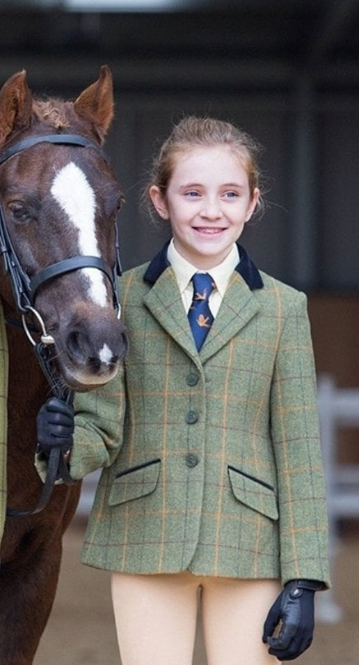 Aubrion Saratoga Childs tweed hacking jacket. Green with a red, yellow and blue check.